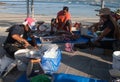 Women clean fresh fish on the shores of the Andaman Sea, in Patong, January 28, 2019. Fish Market. Asia. Phuket Thailand