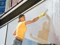 Women cleaning a window Royalty Free Stock Photo