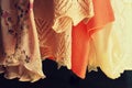 Women clothes hanging on racks in a boutique store