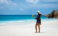 Women with a coconut drink on a tropical beach La Digue Seychelles Islands Royalty Free Stock Photo
