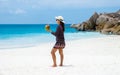 Women with a coconut drink on a tropical beach La Digue Seychelles Islands Royalty Free Stock Photo