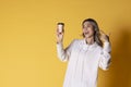 Women with coffee on yellow background Royalty Free Stock Photo