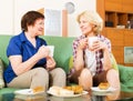 Women colleagues drinking coffe and chatting during pause for lu Royalty Free Stock Photo