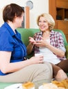 women colleagues drinking coffe and talking during pause for lunch Royalty Free Stock Photo