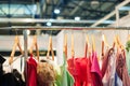 Women colorful dresses hanging in the closet on trempel