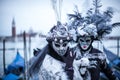 Women with colorful Venetian costume and mask