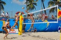 Women Competing in a Professional Beach Volleyball Tournament