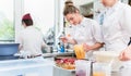 Women in confectioner bakery baking cakes