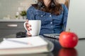 Women on a conference call showing business plan on a childs whiteboard. Working from home concept