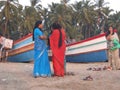 Women conversing on beach