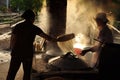 Women cooking rice paste to make rice noodles, vietnam Royalty Free Stock Photo