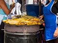 Women cooking and selling roasted ripe plantain at Cali city center