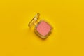 Women cosmetic blush on a yellow background