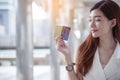 Women crazy shopaholic holding shopping bags , money ,credit card person at shopping malls.Fashionable Woman love online website Royalty Free Stock Photo