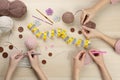 Women crocheting with threads at wooden table, top view Royalty Free Stock Photo