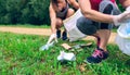 Women picking up trash doing plogging Royalty Free Stock Photo