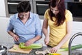 Women cutting celery and leek