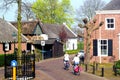 Women are cycling in the ancient Kerkebuurt (Church district) in Soest, Netherlands