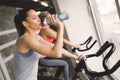 Women cycling in gym during fitness class Royalty Free Stock Photo