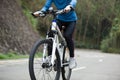 Women cyclist cycling mountain bike on forest trail Royalty Free Stock Photo