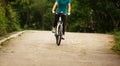 Women cyclist cycling mountain bike on forest trail Royalty Free Stock Photo