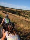 Women cyclists in hills