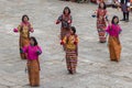 Female dancers at Tshechu religious festival in Paro fortress, Bhutan Royalty Free Stock Photo