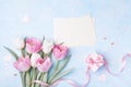 Women Day, Mother day background with envelope, gift box and beautiful spring tulip flowers on pastel blue desk. Flat lay