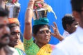 Women devotees carry scared pots in their heads and participates in the Thaipusam festival