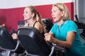 Women of different age training on exercycle Royalty Free Stock Photo