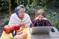 Women discussing music with her grandson