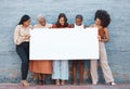 Women, diversity and poster with space outdoor for billboard, mockup or advertising on board. Strong entrepreneur female Royalty Free Stock Photo