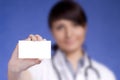 Women Doctor holding blank card