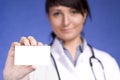 Women Doctor holding blank card Royalty Free Stock Photo