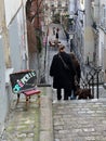 Women and dog descend staircase of rue AndrÃÂ© Antoine, Montmartre, Paris, France