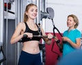 Women doing powerlifting on machines Royalty Free Stock Photo