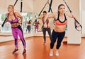 Women doing push ups training arms trx Royalty Free Stock Photo