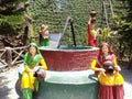 Women drawing water from a well