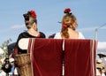 Women dressed in traditional costumes on a horse drawn carriage at the April Fair Feria de Abril, Seville Fair Feria de Sevilla Royalty Free Stock Photo