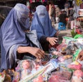 Women shop for dolls in Kabul, Afghanistan