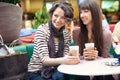 women drinking coffee and chatting