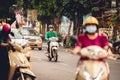 Women driving motorbikes and mopeds in a heavy city traffic in Hanoi, Vietnam Royalty Free Stock Photo