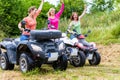 Women driving off-road with quad bike or ATV Royalty Free Stock Photo