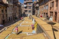 Women drying rice in front of their homes in Kirtipur Royalty Free Stock Photo