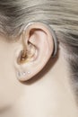 Women ear with hearing aid Royalty Free Stock Photo