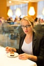 Women eating dessert in fancy restaurant.