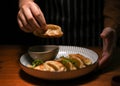 Women eating gyoza with her hand. Japan fried dumplings