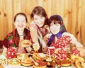 Women eating pancake with caviare during Shrovetide Royalty Free Stock Photo