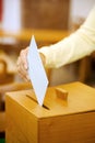 Women in the election with ballots and ballot box