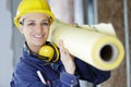 women electrician carrying roll paper plan Royalty Free Stock Photo